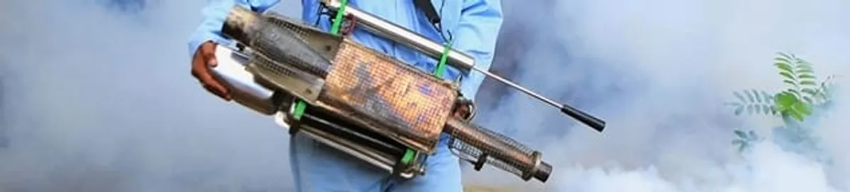 Fumigation technician using a fogger for deep pest treatment in Madison, WI
